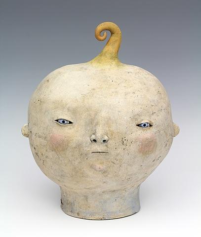 big baby head with curl and foxy grin