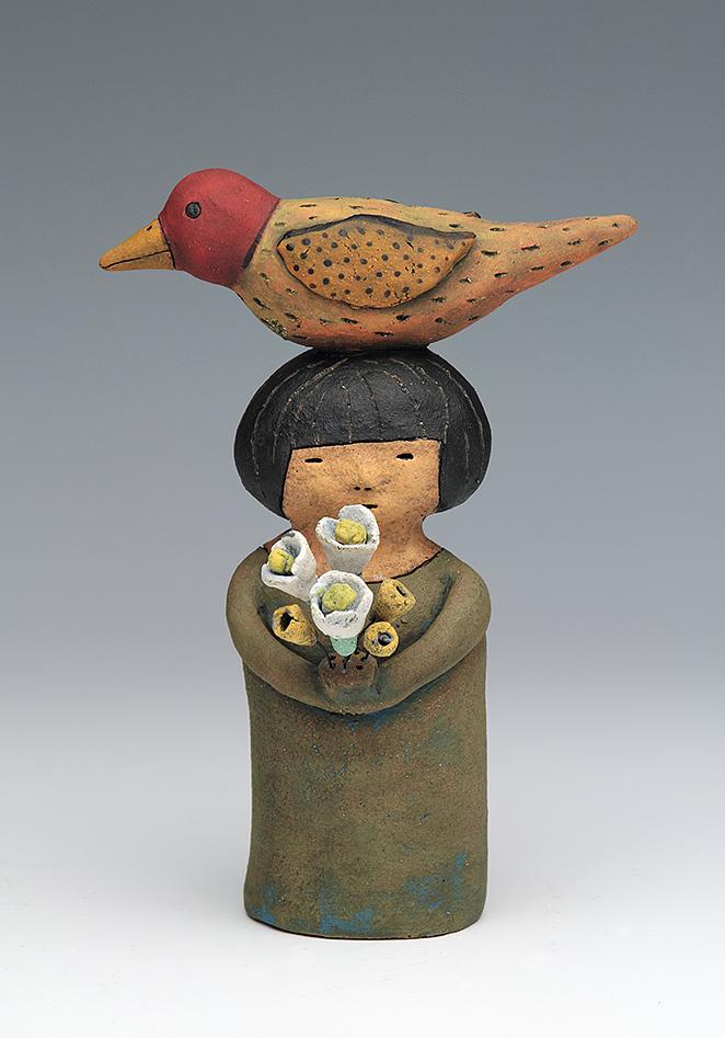 ceramic figure with bird by Sara Swink