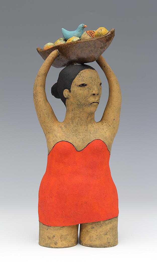 clay ceramic figure with fruit and bird by sara swink